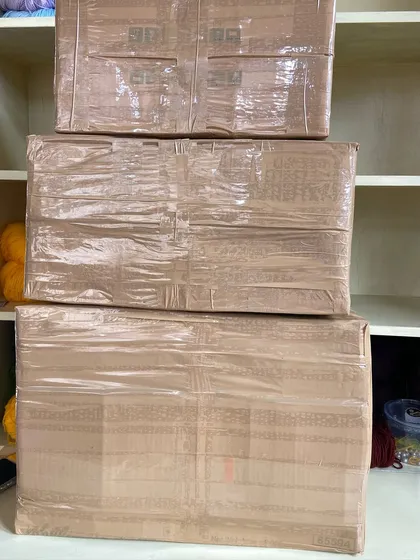 A stack of three large boxes, all packed and ready for the November 1st dispatch.