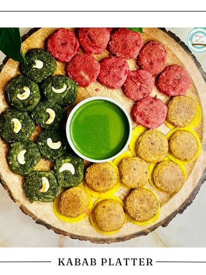 Our Kebab Platter is a perfect treat for Rakhi. It features a colorful assortment of our signature vegetarian kebabs, including hara bhara and beetroot, arranged beautifully on a wooden platter.