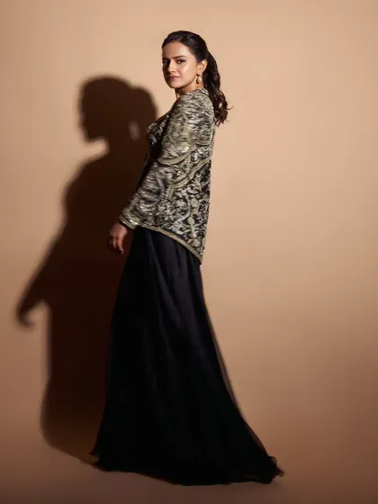 For the 'Celebrating Venky 75' event, I styled Shraddha Srinath in this elegant black ensemble. The heavily embroidered jacket over a flowing skirt creates a look that is both regal and modern.
