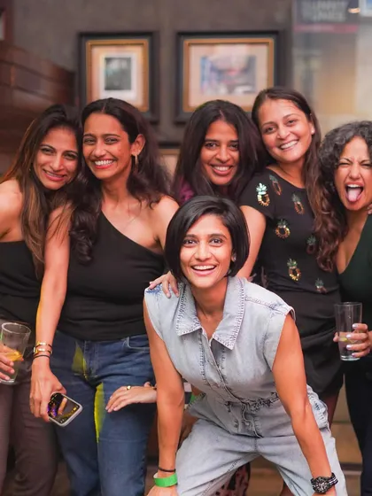 A group of ladies having a fantastic time at Hardrock Cafe.