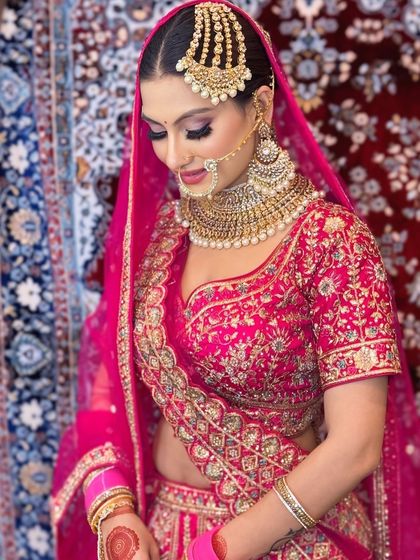A close-up of the bride, showing the details of her passajewelry and the shimmery eye makeup.