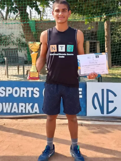 Yashvardhan Singh with his trophy and certificate after winning the Doubles final of the Championship Series Under-16 tournament in New Delhi.