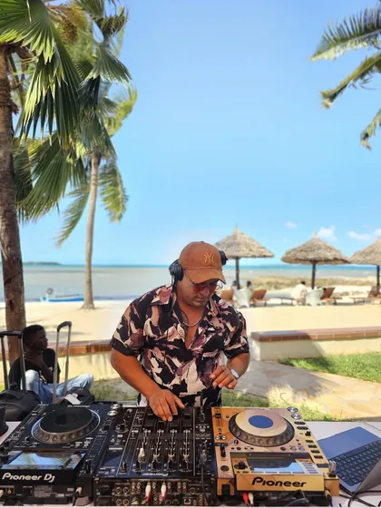 DJing at a beautiful beachside wedding in Tanzania. My work takes me to incredible locations, and I'm always ready to bring the party, whether it's in a grand ballroom or on a sandy shore.