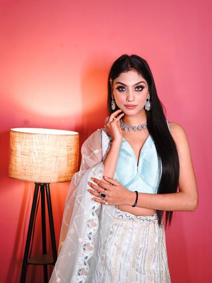 This shot shows the detail on the blouse and the diamond-style necklace that complements it perfectly. The right accessories can truly elevate your ethnic wear.