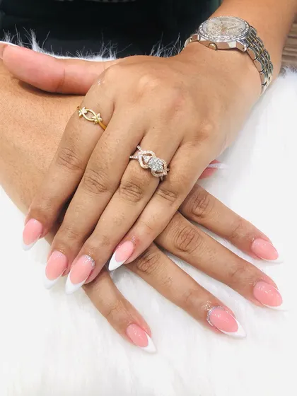 A classic almond-shaped French manicure. This is a beautiful and popular choice that elongates the fingers.