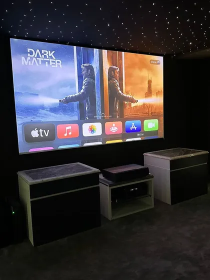 This setup features an ultra-short-throw (UST) projector, which delivers a large, vibrant 4K image from just inches away from the wall, paired with an Apple TV for easy access to all your content.
