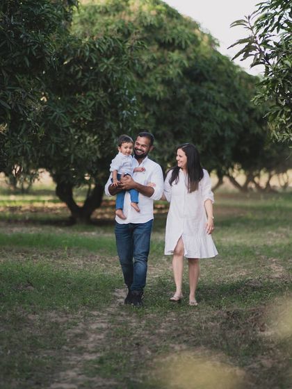 A family walking together in a park.