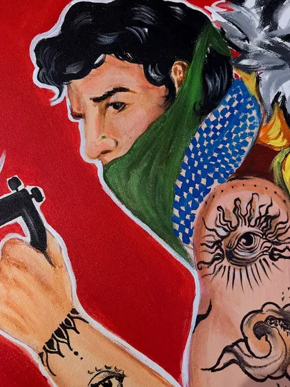 A close-up on another part of the pop-art canvas, this time showing a man with intricate tattoo illustrations on his arm.