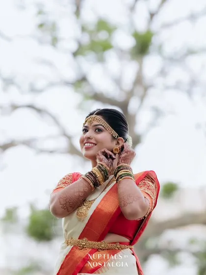 A joyful moment for the bride on her wedding day. Her makeup is fresh and radiant, designed to look great in outdoor, natural lighting.