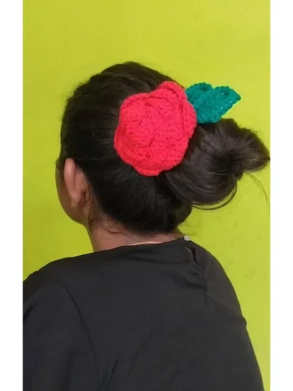 A beautiful crochet rose hairclip, perfect for buns and updos. This adds a romantic, floral touch to your hairstyle.