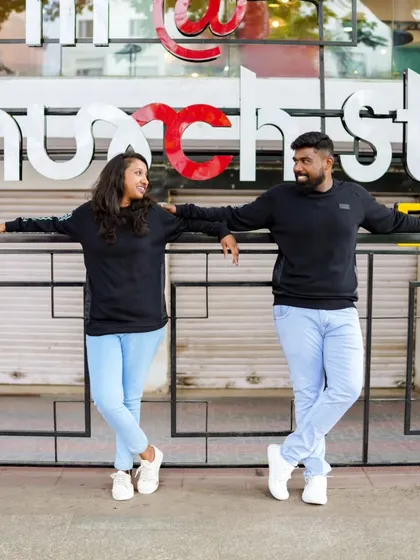 A casual and cool pose in front of a modern building. We can make any city location work for your pre-wedding shoot.