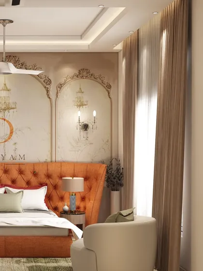 Another angle of the orange-themed bedroom, showing the interplay of light from the window and the elegant wall sconces.