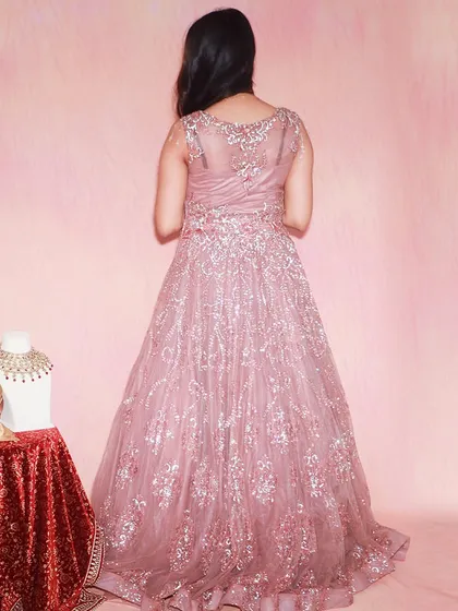 The back of this pink ball gown is just as stunning, with delicate sheer fabric and intricate sequin work.
