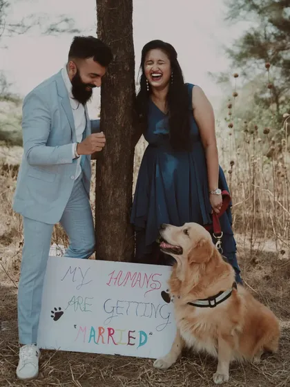 Including furry family members in your big announcement! This fun and heartwarming pre-wedding photo shows our flexible approach, helping you create shoots that are personal and full of joy.