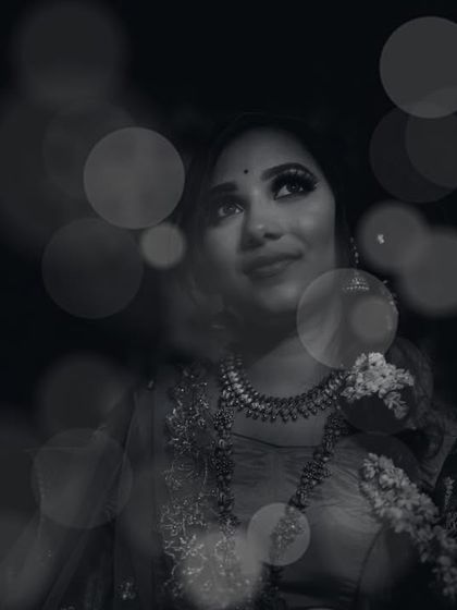 A moody and atmospheric black and white portrait. By combining a soft focus on the subject with a creative bokeh overlay, we created an image that feels dreamy, introspective, and full of emotion.