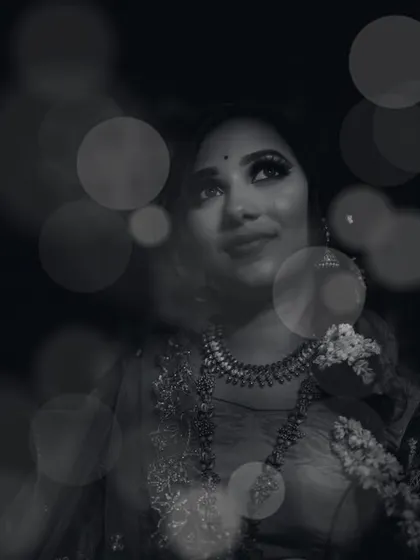 A moody and atmospheric black and white portrait. By combining a soft focus on the subject with a creative bokeh overlay, we created an image that feels dreamy, introspective, and full of emotion.
