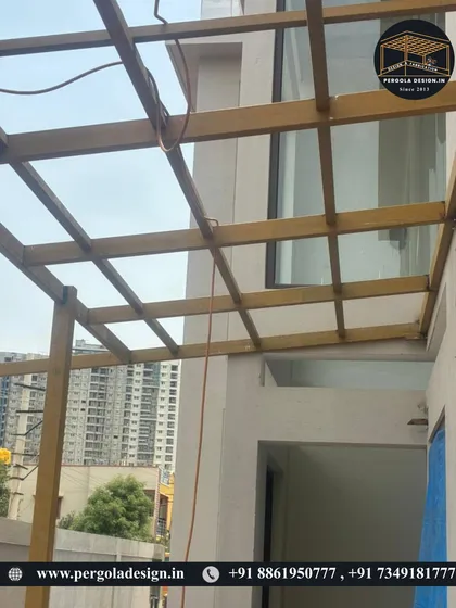 A perspective shot showing the carport framework against the city skyline. Even in the early stages, the precision of the fabrication is clear. We build structures that are not only functional but also architecturally sound and built to last for decades.
