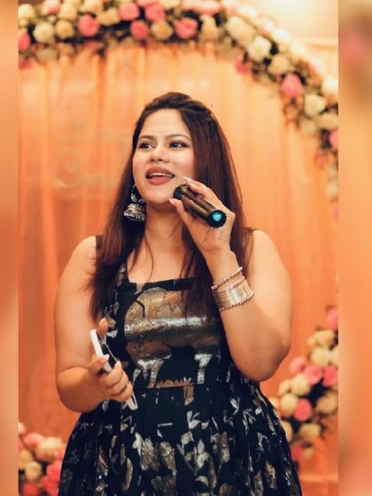 Holding my phone and mic, I'm always connected and ready to coordinate with the DJ and event planner.