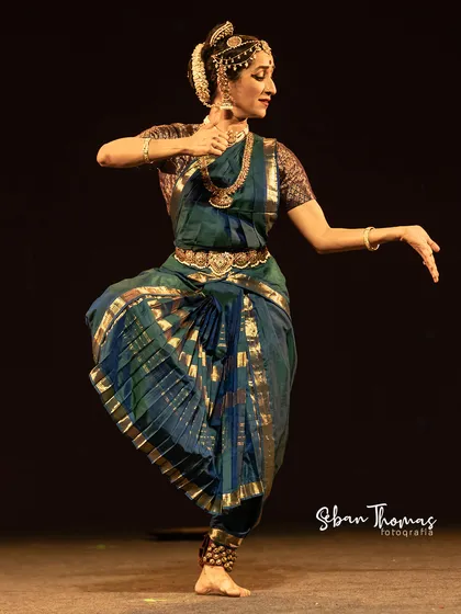Another moment from the recital, showcasing the traditional pleated costume that fans out beautifully with movement.