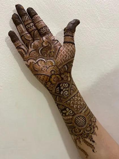 A detailed bridal arm design, created with prayers for peace and happiness. The patterns are inspired by the rich traditions of henna art.