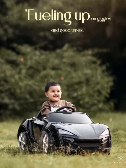 Fueling up on giggles and good times. This happy boy is having a blast driving his toy car through the grass.