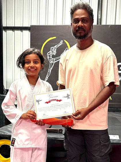 This young girl earned her orange belt. We are proud to see so many dedicated girls excelling in our karate program.