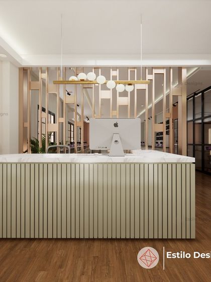 The reception desk for this contemporary office features a clean, minimalist design with a fluted wood base and a marble top. The decorative screen behind the desk adds a layer of visual interest and separates the reception from the main workspace.