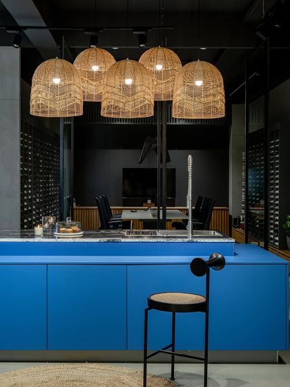 Another view of the vibrant blue island in our Ahmedabad showroom, a testament to how we can use bold color to create a stunning focal point.