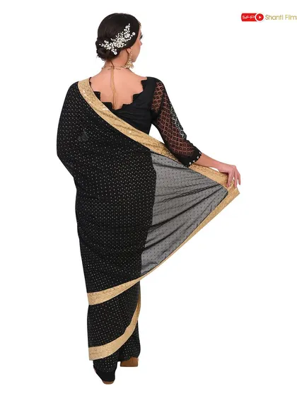 A back view of the model, highlighting the blouse design and the way the saree is draped. This angle is essential for a complete product listing on any e-commerce platform.