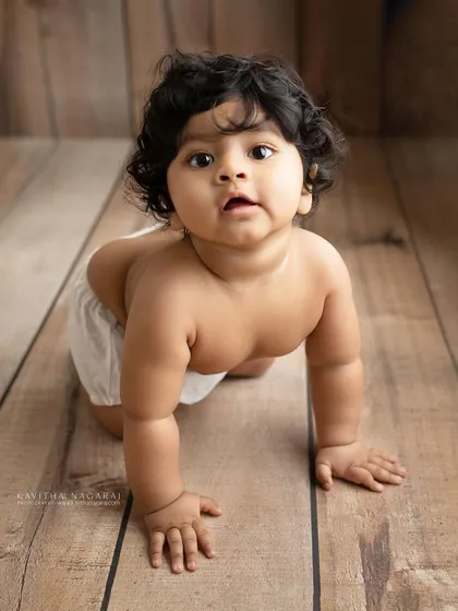 Eight-month-old Viaan on the move. His determined crawl and curious expression perfectly capture the spirit of the sitter stage.
