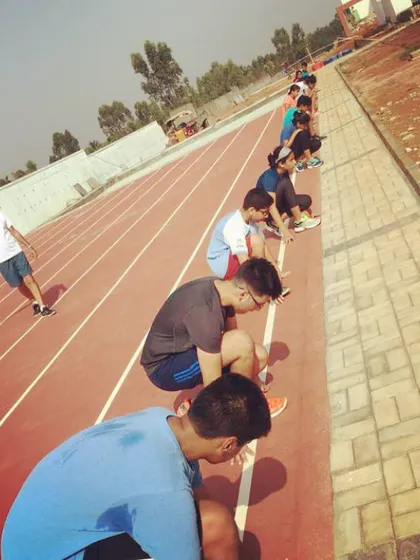 Our training extends beyond the squash court. Here, our athletes are lined up on the track for flying sprints, a key part of our program to build explosive speed and endurance.