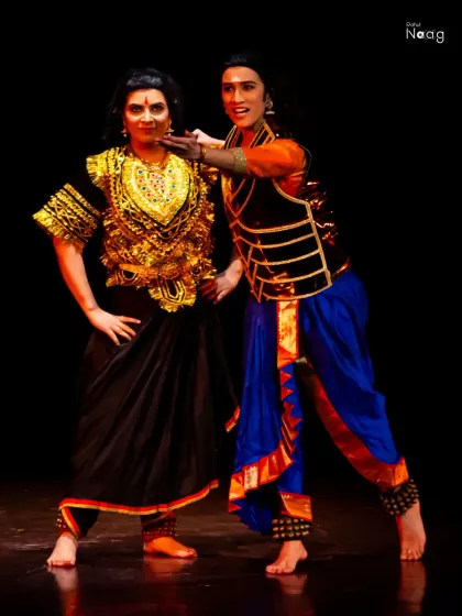 Portraying a dynamic interaction between characters on stage. My ability to create strong shapes and convey relationships through posture is a key part of my theatrical modeling work.
