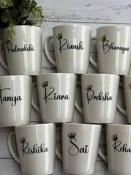 Our classic aesthetic white ceramic mugs, personalised with names and a small crown. These are perfect for return gifts or for your morning coffee.
