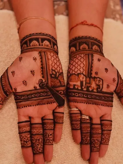 A simple yet elegant design for the back of the hands, featuring elephant and peacock motifs.