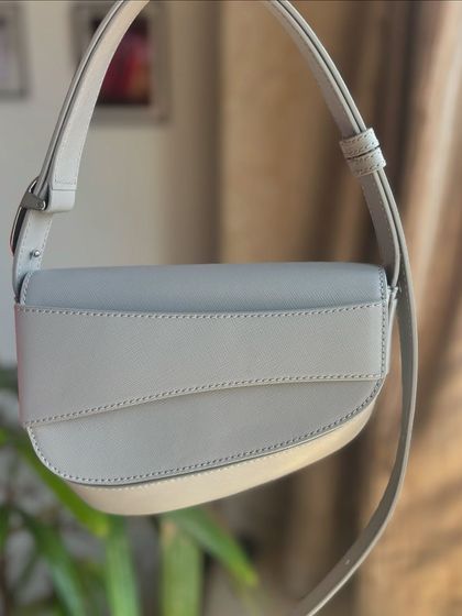 This gorgeous grey bag was another one of my favorite NYC finds. The color is the perfect neutral and the unique shape makes it a statement piece.