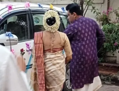 A view of the bride's back, showing the neatness of the drape and how it complements her intricate hairstyle. A secure drape is essential for a bride's peace of mind.