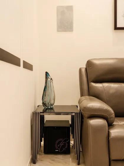This shot highlights the discreetly placed subwoofer and wall-mounted speaker, part of the integrated sound system that delivers rich, immersive audio for the home theater.