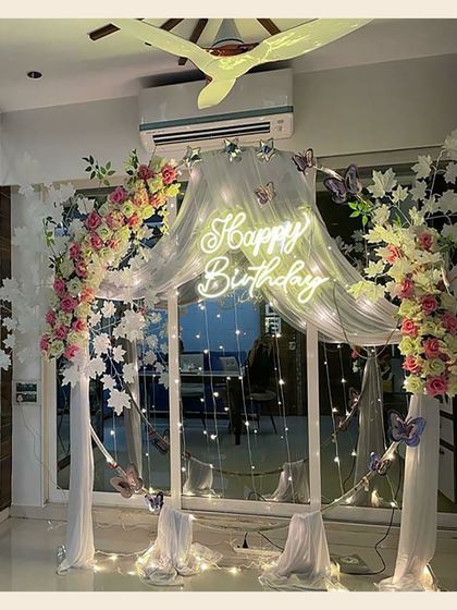 The complete look of the butterfly-themed floral arch. It’s a versatile design that can be customized with different flowers and colors to match your party's theme perfectly.