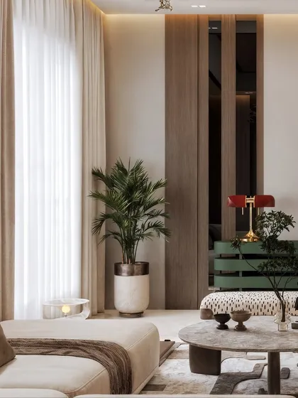 A detail shot focusing on the layered textures of the coffee table, patterned bench, and indoor plants.