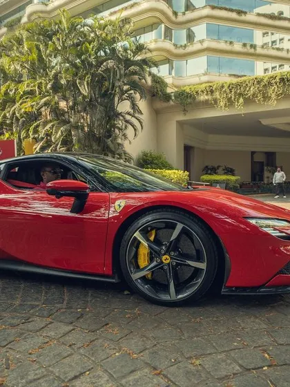 A close-up of the striking red Ferrari SF90. I select tracks that embody the power, speed, and elegance of the brands I work with.