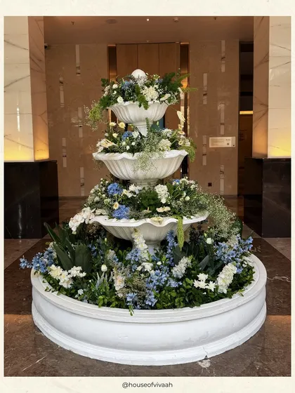 This collection of images provides a deeper look into my blue and white themed events. You will find details like custom stationery, floral-filled fountains, elegant table settings with blue pottery, and beautifully styled lounge areas, all showcasing a timeless and sophisticated design approach.