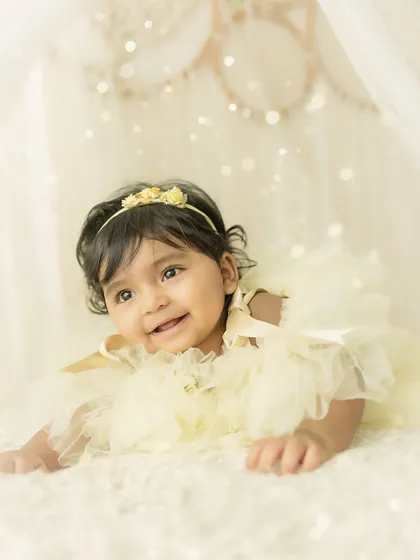 A curious and sweet expression. I love capturing the full range of a baby's personality during these sessions.