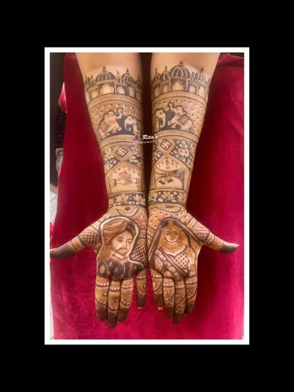 The full view of the anniversary mehendi, combining portraits with traditional symbols and architectural elements to create a grand design.