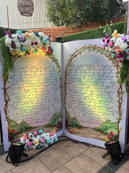 The storybook prop illuminated at night, creating a dramatic and magical effect.