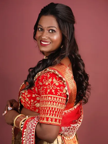A side profile showing the soft, flowing hairstyle and the beautifully blended cheek color.