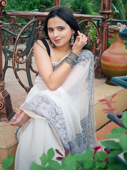 A portrait of the model highlighting the saree and matching oxidized silver jewellery.