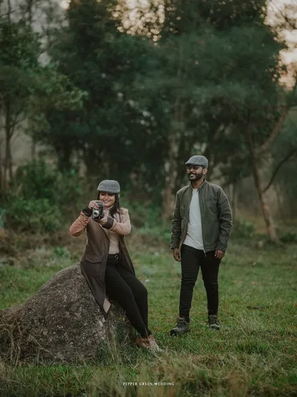 The bride-to-be captures a memory with a vintage camera, adding a unique storytelling layer to their classic, rustic pre-wedding session.
