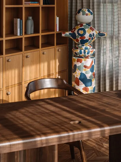 This custom 'MuseTRIBE' floor lamp is a scaled-up version of the wooden toys we designed with Channapatna artisans. We collaborated with an artist to hand-paint the lamp, turning it into a vibrant, oversized sculpture that brings life to the library.