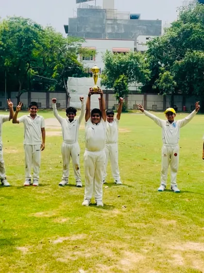 The young team celebrating their first tournament victory. This is just the beginning for them.