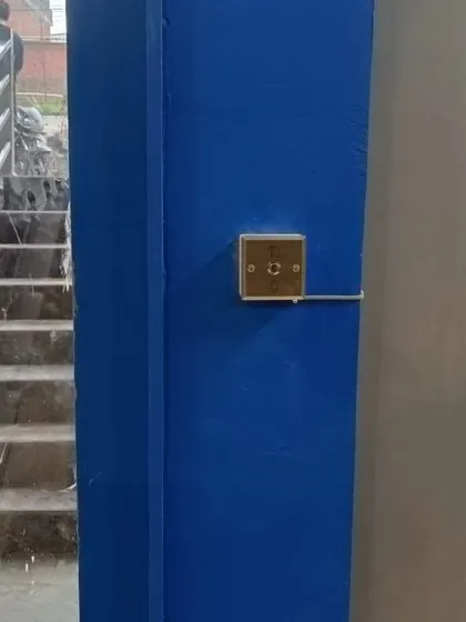This image shows the exit button installed as part of the gym's new access control system in Kanpur. The wiring is run cleanly along the wall for a professional finish.